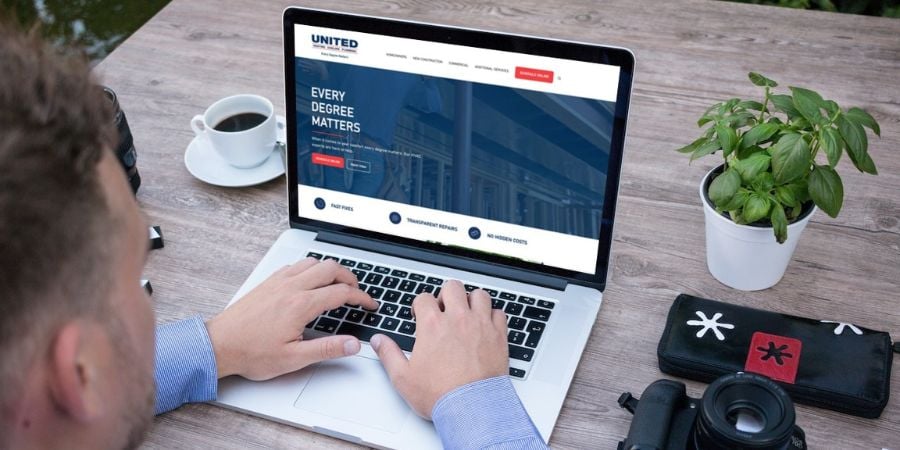 Man working on website on computer