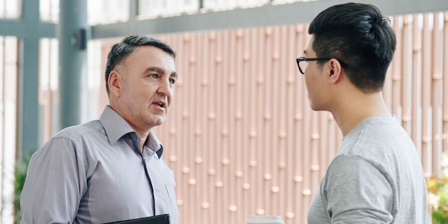 entrepreneur talking to young employee