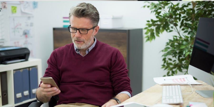 manager of the company texting in the office